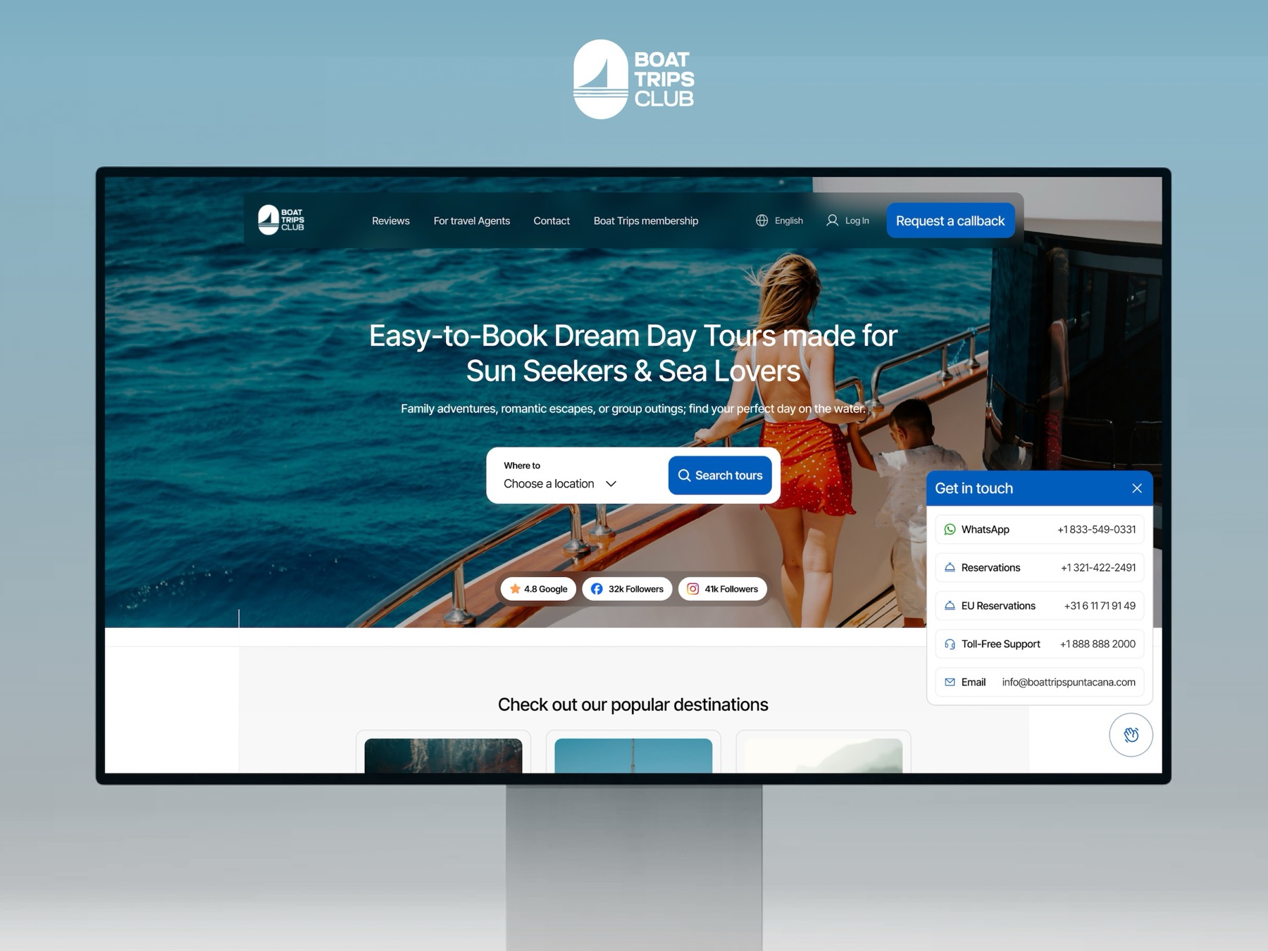 The Boat Trips Club homepage on a desktop monitor: ocean hero, tour search, and a get-in-touch panel with WhatsApp, reservations, and toll-free lines.